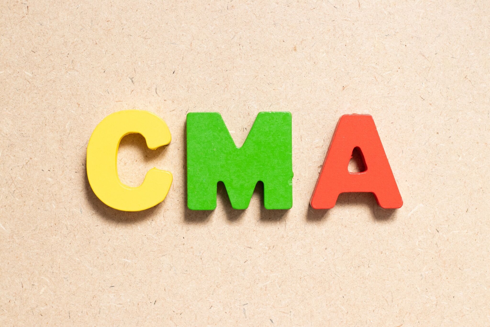 Colored alphabet blocks that spell CMA